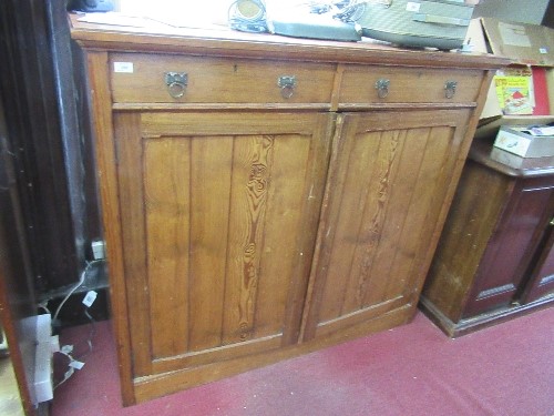 A 19th century pitch pine cupboard, fitted with two drawers over two planked doors, width 53ins x