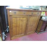 A 19th century pitch pine cupboard, fitted with two drawers over two planked doors, width 53ins x