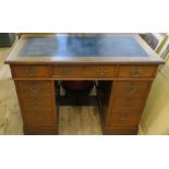 A late 19th century mahogany pedestal desk, having three frieze drawers, over two banks of three