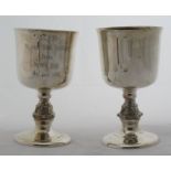 A pair of modern silver goblets, one with inscription, Birmingham 2002, weight 10oz, together with a