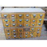 A set of 36 pigeonhole card index drawers, in two sections each of 18 drawers, width 39.75ins x