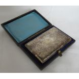 A Victorian cased silver aide memoire, with engraved decoration from and back with initials and a