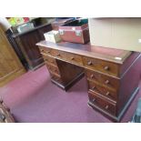 A 19th century kneehole mahogany desk, having a central frieze drawer, stamped Heal and Son