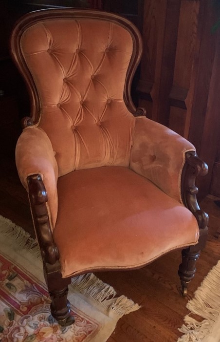 A 19th century grandfather's chair, with scroll arms