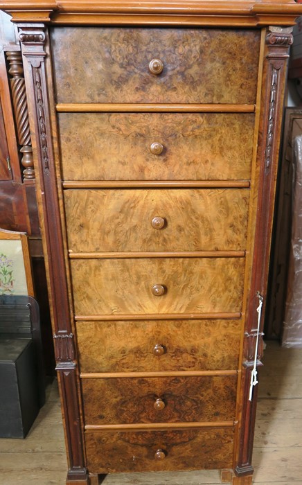 A 19th century burr walnut Wellington chest, having an associated top, fitted with seven drawers,