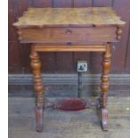 A 19th century mahogany writing table, with twin quarter veneered sliding top, opening to reveal ink