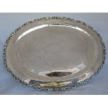 A Mexican Sterling silver oval tray, with scroll embossed edge, weight 46oz, maximum diameter 19.