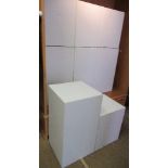 8 white cubic display boxes, four 20ins square, four 30ins square, together with two 3 x 4 cube