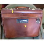 A LEATHER BRIEFCASE WITH CONCORDE STICKER