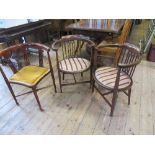 A pair of Edwardian mahogany and satinwood inlaid elbow chairs, together with a similar corner chair