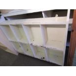 A set of white painted shelves