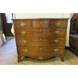 A 19th mahogany sepentine shaped chest of drawers, having three short drawers over two graduated