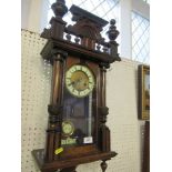 A 19th century carved walnut wall clock