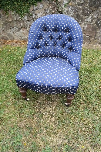 A Victorian childs button back chair, with blue fabric