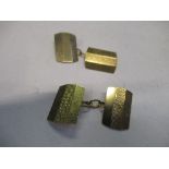 A pair of 9 carat gold cufflinks, Chester date letter indistinct, rectangular panels with engine