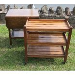 An oak tea trolley having three slated shelves, together with a another tea trolley with drop