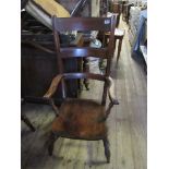 A mahogany ladder back armchair