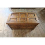 An oak coffer, with panelled top and sides, width 38ins