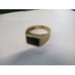 A 9 carat gold black onyx set ring, finger size M, 2.7g gross