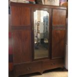 A mahogany mirror door wardrobe, with two drawers to the base, height 78ins width 60ins