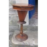 A Victorian walnut octagonal sewing table, with fitted interior, raised on a carved column, diameter