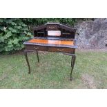 An Edwardian ladies writing desk , with brass gallery over pigoen holes and drawers, width 39ins,