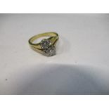 A two stone diamond cross over ring, stamped '22ct', the brilliant cuts of approximately 0.25 and
