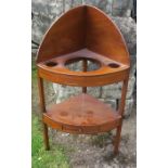 A 19th century mahogany corner wash stand, the top with spaces for wash jug and bowl, the lower