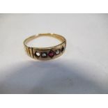 A 15 carat gold ring, some settings vacant, 1.6g gross