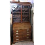 A 19th century mahogany bureau bookcase, the upper section having two astregal lazed doors, the