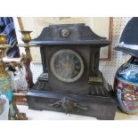 A black slate mantel clock