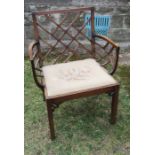 A Georgian mahogany Chinese Chippendale style armchair, with lattice to the back and bowed lattice