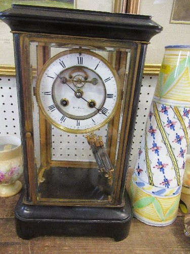 A brass four glass mantle clock ,