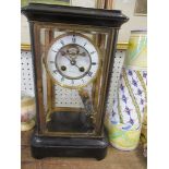 A brass four glass mantle clock ,