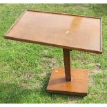 An oak adjustable table, with rectangular top together with a standard lamp