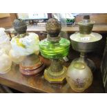 A collection of oil lamps etc