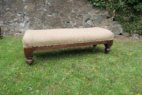 A 19th century long stool, raised on bulbous bun feet, length 45ins, width 16.5in, height 13.5ins