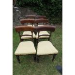 A harlequin set of six 19th century bar back dining chairs, four having tulip decoration