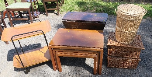 A nest of tables, tea trolley, small gateleg table, two wicker picnic baskets and a laundry basket