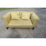 A late Victorian/Edwardian style two seater sofa, with drop end, tapered legs, width 60ins, depth