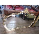 A gilt framed mirror