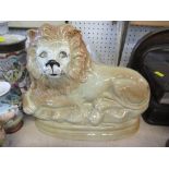 A staffordshire style model of a lion