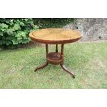 An Edwardian brass inlaid centre table, with quarter veneered decoration to the top, diameter 33.