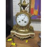 A 19th century French gilt and marble mantle clock, with urn finial , twin trail movement, with
