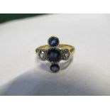 A sapphire and diamond 18 carat gold ring, the central sapphire with a sapphire above and below with
