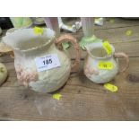 Two Locke and Co blush ivory graduated jugs, with floral decoration, height 5ins and 3.5ins