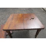 A 19th century oak extending dining table, with two extra leaves and winder, max length 70ins, width