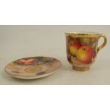 A Royal Worcester coffee cup, decorated with fruit to a mossy background by Freeman, together with a