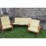 A 'Domino' Danish three piece suite, stamped, settee width 74ins, chairs width 30ins