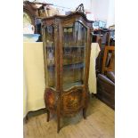 A Vernis Martin style display cabinet, having applied gilt mounts with glazed door opening to reveal